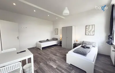 Ein Bett oder Betten in einem Zimmer der Unterkunft BEGE APARTMENTS SmartLiving