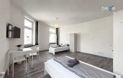 Ein Bett oder Betten in einem Zimmer der Unterkunft BEGE APARTMENTS SmartLiving