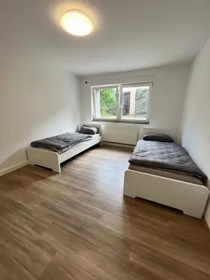 Ein Bett oder Betten in einem Zimmer der Unterkunft Ihr Zuhause in Herne Wohnen am Park