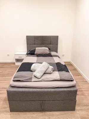 Ein Bett oder Betten in einem Zimmer der Unterkunft Ruhr Business Apartments Essen Apartment mit 8 Einzelbetten Privat Parkplatz