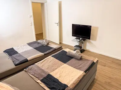 Ein Bett oder Betten in einem Zimmer der Unterkunft Ruhr Business Apartments Essen Apartment mit 8 Einzelbetten Privat Parkplatz