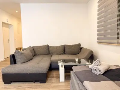 Ein Sitzbereich in der Unterkunft Ruhr Business Apartments Essen Apartment mit 8 Einzelbetten Privat Parkplatz