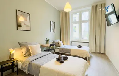 Ein Bett oder Betten in einem Zimmer der Unterkunft BEGE APARTMENTS HomeBase