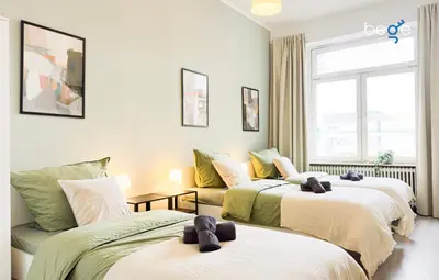 Ein Bett oder Betten in einem Zimmer der Unterkunft BEGE APARTMENTS HomeBase