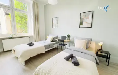Ein Bett oder Betten in einem Zimmer der Unterkunft BEGE APARTMENTS HomeBase