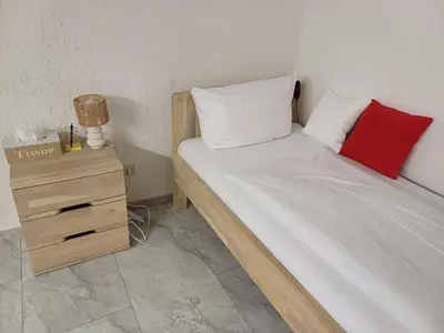 Ein Bett oder Betten in einem Zimmer der Unterkunft Guest house in Datteln