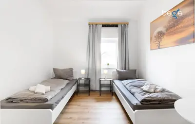 Ein Bett oder Betten in einem Zimmer der Unterkunft BEGE APARTMENTS Company Inn