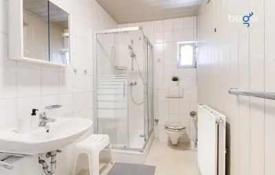 Ein Badezimmer in der Unterkunft BEGE APARTMENTS Company Inn