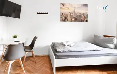 Ein Bett oder Betten in einem Zimmer der Unterkunft BEGE APARTMENTS Company Inn