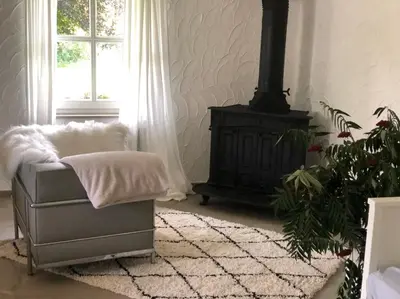 Ein Sitzbereich in der Unterkunft Das Gartenhäuschen im Landhaus im Park