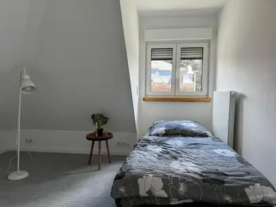 Ein Bett oder Betten in einem Zimmer der Unterkunft Nathanael Ferienwohnung mit Küche, WLAN & 4 Schlafzimmern