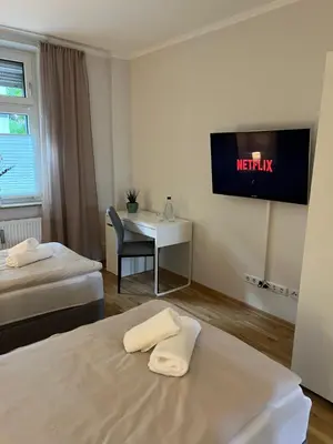 Ein Bett oder Betten in einem Zimmer der Unterkunft Ruhrperle Apartment 2 Essen