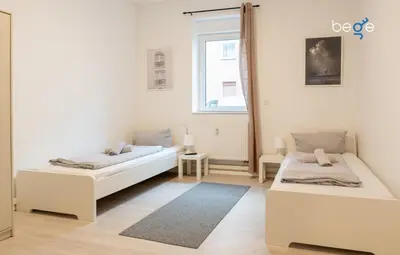 Ein Bett oder Betten in einem Zimmer der Unterkunft BEGE APARTMENTS TeamLodge