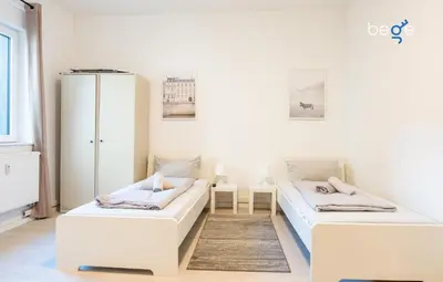 Ein Bett oder Betten in einem Zimmer der Unterkunft BEGE APARTMENTS TeamLodge