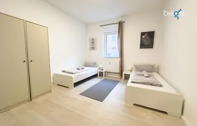 Ein Bett oder Betten in einem Zimmer der Unterkunft BEGE APARTMENTS TeamLodge
