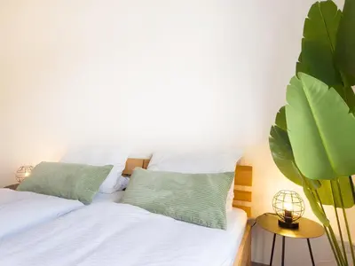 Ein Bett oder Betten in einem Zimmer der Unterkunft Ideal für Familien & Business - 3 SZ - zentral Wuppertal - Nähe Köln & DUS - 240 cm Esstisch