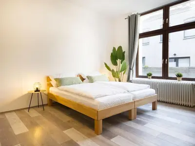 Ein Bett oder Betten in einem Zimmer der Unterkunft Ideal für Familien & Business - 3 SZ - zentral Wuppertal - Nähe Köln & DUS - 240 cm Esstisch