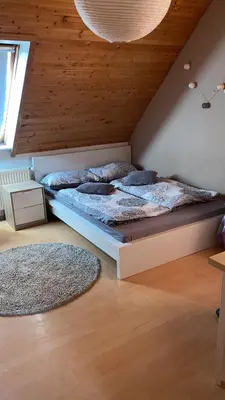 Ein Bett oder Betten in einem Zimmer der Unterkunft Zentral im Grünen