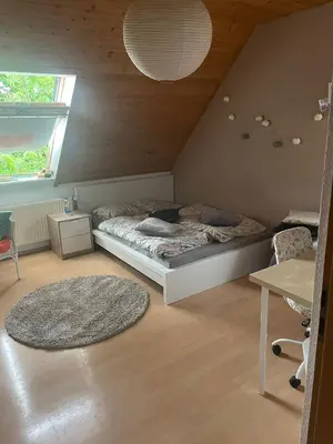 Ein Bett oder Betten in einem Zimmer der Unterkunft Zentral im Grünen