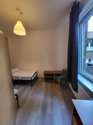 Ein Bett oder Betten in einem Zimmer der Unterkunft Kleine Wohnung Nähe Reihn