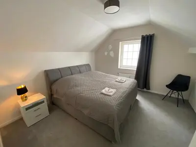 Ein Bett oder Betten in einem Zimmer der Unterkunft LivingSpace Messe Essen