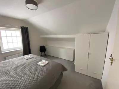 Ein Bett oder Betten in einem Zimmer der Unterkunft LivingSpace Messe Essen
