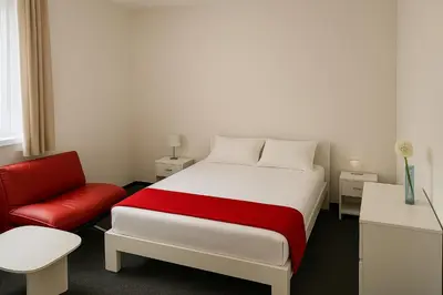 Ein Bett oder Betten in einem Zimmer der Unterkunft Artur Hotel