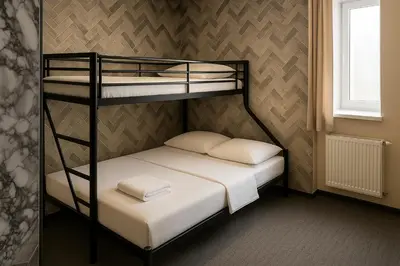 Ein Bett oder Betten in einem Zimmer der Unterkunft Artur Hotel