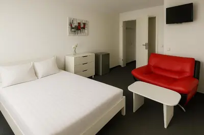 Ein Bett oder Betten in einem Zimmer der Unterkunft Artur Hotel