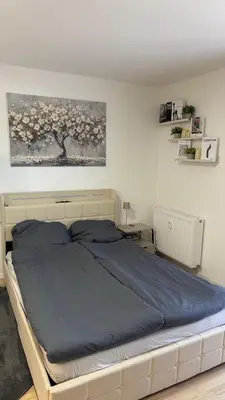 Ein Bett oder Betten in einem Zimmer der Unterkunft Modernes City Apartment mit Parkplatz