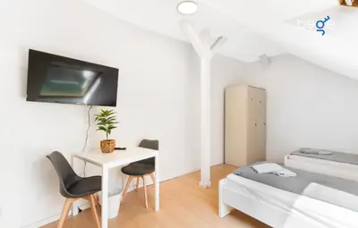 Ein Bett oder Betten in einem Zimmer der Unterkunft BEGE APARTMENT Cozy Workbase