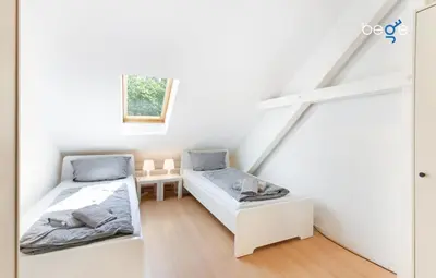 Ein Bett oder Betten in einem Zimmer der Unterkunft BEGE APARTMENT Cozy Workbase