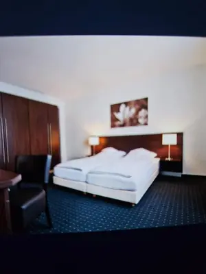 Ein Bett oder Betten in einem Zimmer der Unterkunft Hotel&Spa am Oppspring