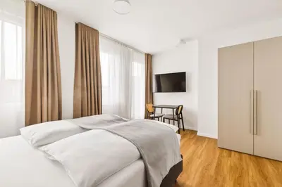 Ein Bett oder Betten in einem Zimmer der Unterkunft Limehome Bochum Kortumstr