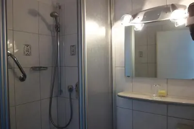 Ein Badezimmer in der Unterkunft Hotel Lex