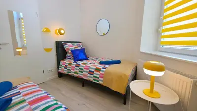 Ein Bett oder Betten in einem Zimmer der Unterkunft Blumenhof Duisburg HBF