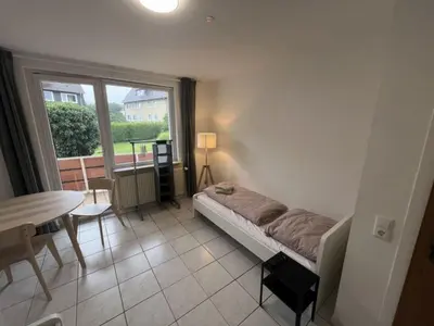 Ein Bett oder Betten in einem Zimmer der Unterkunft Work and Sleep Hagen 6 Pers Komfortwohnung für Gruppen H6
