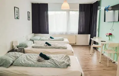 Ein Bett oder Betten in einem Zimmer der Unterkunft BEGE APARTMENTS Remote Base