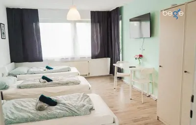 Ein Bett oder Betten in einem Zimmer der Unterkunft BEGE APARTMENTS Remote Base