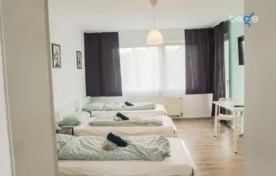 Ein Bett oder Betten in einem Zimmer der Unterkunft BEGE APARTMENTS Remote Base