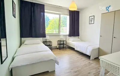 Ein Bett oder Betten in einem Zimmer der Unterkunft BEGE APARTMENTS Remote Base