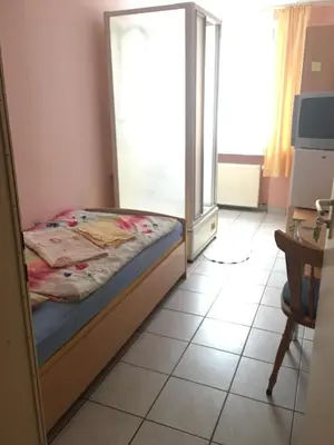Ein Bett oder Betten in einem Zimmer der Unterkunft Hotel Yans