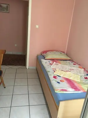 Ein Bett oder Betten in einem Zimmer der Unterkunft Hotel Yans