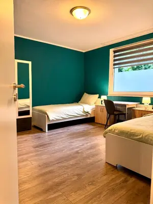 Ein Bett oder Betten in einem Zimmer der Unterkunft Emerald Apartment