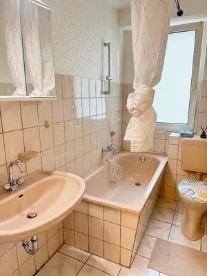 Ein Badezimmer in der Unterkunft Emerald Apartment