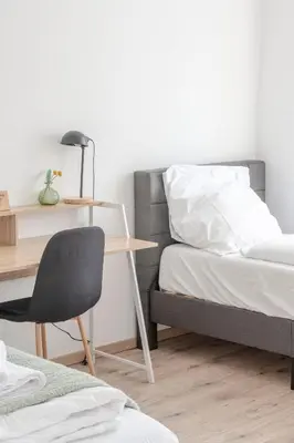 Ein Bett oder Betten in einem Zimmer der Unterkunft SpaceStays Apartment For 6