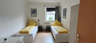 Ein Bett oder Betten in einem Zimmer der Unterkunft Working Professionals Flat