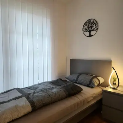Ein Bett oder Betten in einem Zimmer der Unterkunft Wohnung in Düsseldorf