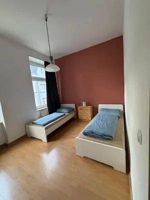 Ein Bett oder Betten in einem Zimmer der Unterkunft Kings Appartement