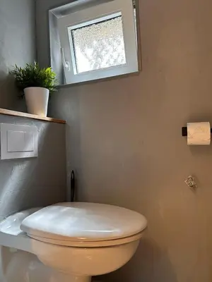Ein Badezimmer in der Unterkunft Seenahe Wohnung mit Gemeinschaftsgarten und -pool